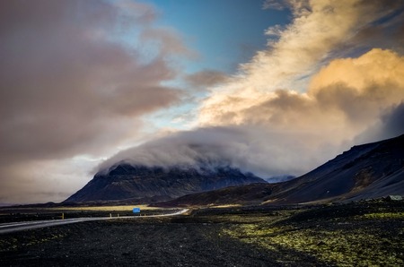 Vatnajokull Glacier covered in fog with mountains and blue skyの写真素材