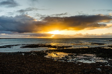 Sunset over the Atlantic Ocean in Icelandの写真素材