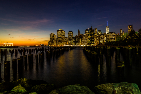 New York Skyline Cityscape Lower Manhattan World Trade Center Freedom Tower from Brooklyn Bridge Park Pierの写真素材