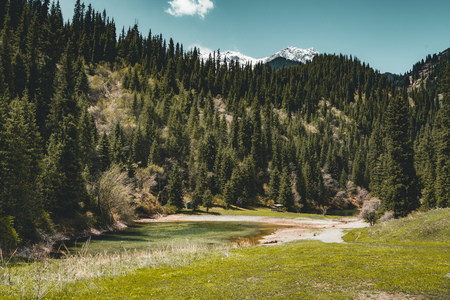 Street in steppe with Tian Shan mountains in background, Kazakhstan Central Asiaの写真素材