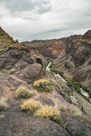 River in Charyn canyon in the Kazakhstan with mountains and sky clouds.の写真素材