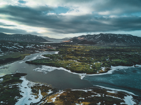 Aerial drone photo of a empty lake a huge volcanic mountain Snaefellsjokull in the distance, Reykjavik, Iceland.の写真素材