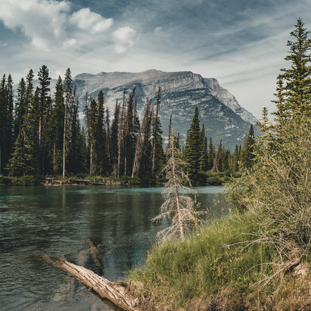 Scenic sunset views over bow river three sisters, Banff National Park Alberta Canadaの写真素材