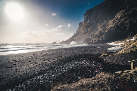 Sunrise at famous Black Sand Beach Reynisfjara in Iceland. Windy Morning. Ocean Waves. Colorful Sky. Morning Sunset.の写真素材