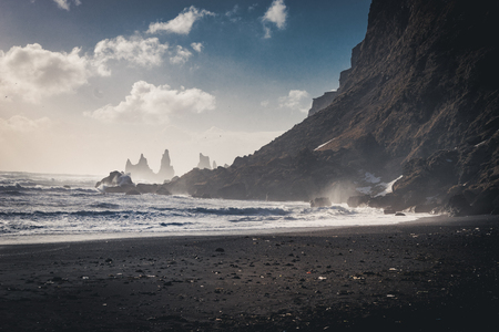 Sunrise at famous Black Sand Beach Reynisfjara in Iceland. Windy Morning. Ocean Waves. Colorful Sky. Morning Sunset.の写真素材