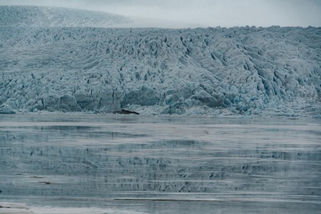 Fjallsarlon Jokulsarlon Huge glacier and mountains in Iceland Vatnajokull glacier aerial drone image with clouds and blue sky. Dramatic winter scene of Vatnajokull National Park, Iceland, Europe. Beauty of nature concept background.の写真素材