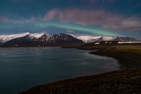 Northern lights on the Diamond beach in south east Iceland, Jokursarlon Vik ice rocks oceanの写真素材