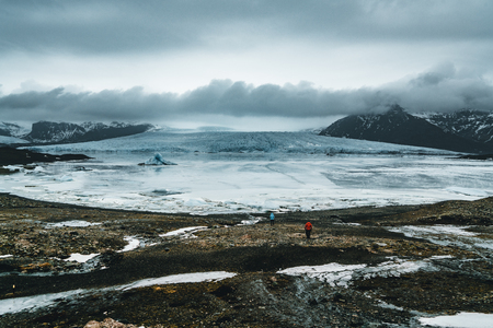 Fjallsarlon Jokulsarlon Huge glacier and mountains in Iceland Vatnajokull glacier aerial drone image with clouds and blue sky. Dramatic winter scene of Vatnajokull National Park, Iceland, Europe. Beauty of nature concept background.の写真素材