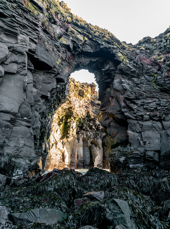 Typical Icelandic sunrise sunset cliff landscape at Arnarstapi area in Snaefellsnes peninsula in Icelandの写真素材