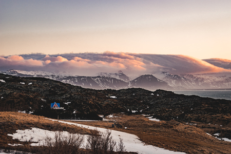 Typical Icelandic sunrise sunset mountain landscape at Arnarstapi area in Snaefellsnes peninsula in Icelandの写真素材