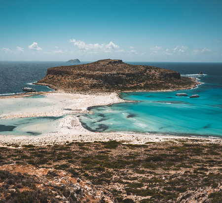 View of the beautiful beach in Balos Lagoon, and Gramvousa island on Crete, Greece. Sunny day, blue Sky with clouds.の写真素材