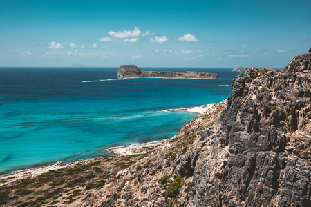 View of the beautiful beach in Balos Lagoon, and Gramvousa island on Crete, Greece. Sunny day, blue Sky with clouds.の写真素材