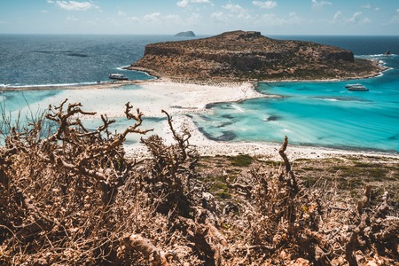 View of the beautiful beach in Balos Lagoon, and Gramvousa island on Crete, Greece. Sunny day, blue Sky with clouds.の写真素材