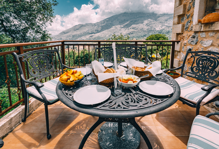 breakfast with fruits, bread, marmalade and cheese on the tableの写真素材