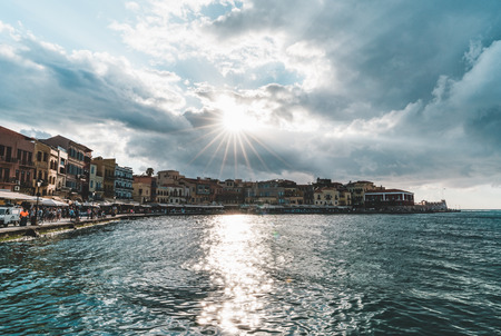 Panorama venetian harbour waterfront and Lighthouse in old harbour of Chania at sunset, Crete, Greeceの写真素材