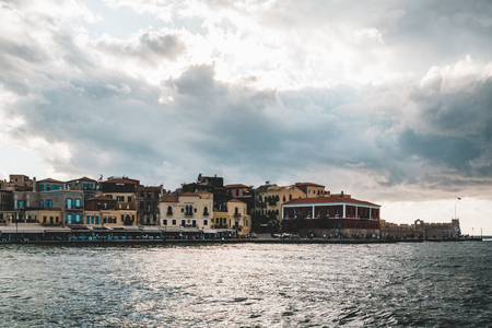 Panorama venetian harbour waterfront and Lighthouse in old harbour of Chania at sunset, Crete, Greeceの写真素材