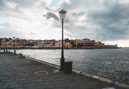 Panorama venetian harbour waterfront and Lighthouse in old harbour of Chania at sunset, Crete, Greeceの写真素材
