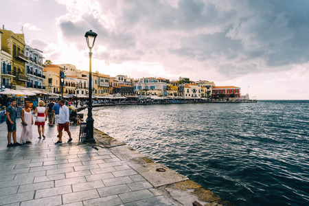 Chania, Crete, Greece - August 2018: Panorama venetian harbour waterfront and Lighthouse in old harbour of Chania at sunsetのeditorial素材