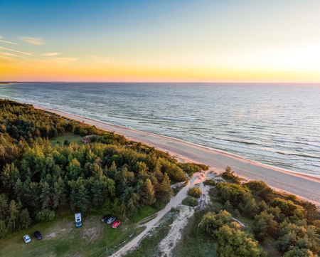 Drone image. aerial view of red sunset in the sea beach. shore line. baltic sea at dust - vintage retro lookの写真素材