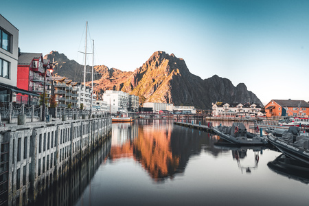 Svolvaer, Norway - September 2018: Boats in the waterfront harbor with mountains in the background. Svolvaer is a fishing village and tourist town located on Austvagoya in the Lofoten Islands.のeditorial素材