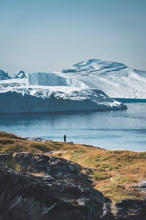 3 people taken photo of Humpback whale in Ilulissat diving in Greenland. Easy hiking route to the famous Kangia glacier near Ilulissat in Greenland. The Ilulissat Icefjord seen from the viewpoint.の写真素材