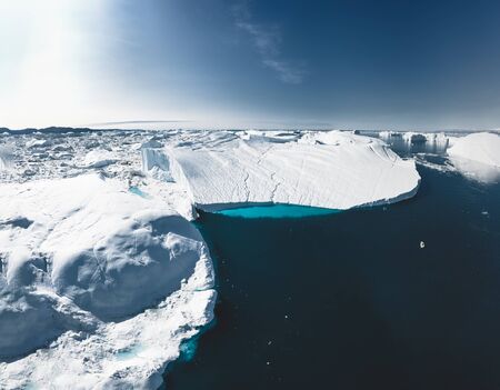 Iceberg and ice from glacier in arctic nature landscape in Ilulissat,Greenland. Aerial drone photo...