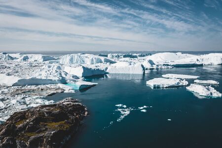 Icebergs drone aerial image top view - Climate Change and Global Warming. Icebergs from melting...