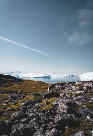 View towards Icefjord in Ilulissat. Easy hiking route to the famous Kangia glacier near Ilulissat in...