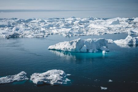 Iceberg and ice from glacier in arctic nature landscape in Ilulissat,Greenland. Aerial drone photo...