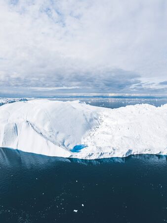 Iceberg and ice from glacier in arctic nature landscape in Ilulissat,Greenland. Aerial drone photo...