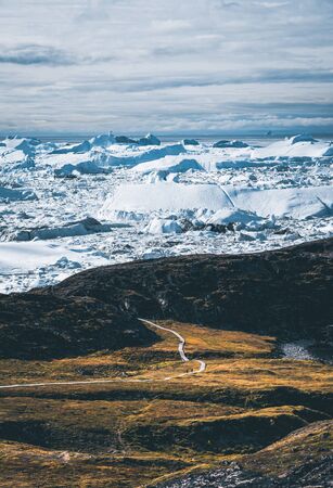 View towards Icefjord in Ilulissat. Easy hiking route to the famous Kangia glacier near Ilulissat in Greenland.の写真素材