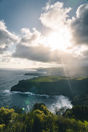Epic scenic outlook of Miradouro de Santa Iria - north coast of Sao Miguel, largest island of Azores archipelago during sunset with dramatic sky and clouds. Photo taken in Azores, Portugal.の写真素材