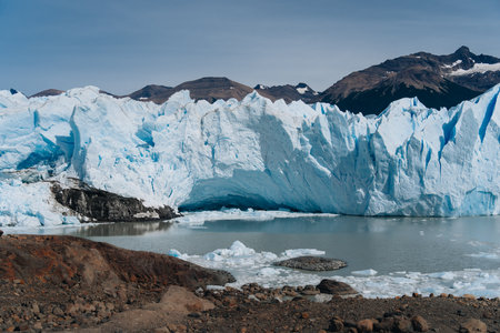 Panoramic view of the gigantic Perito Moreno glacier, its tongue and lagoon in Patagonia, Argentina, sunny day, blue sky.の写真素材