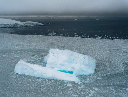 Top view to iceberg. Top and underwater parts of Iceberg. Drone view Antarctica and Arctic Greenland.の写真素材