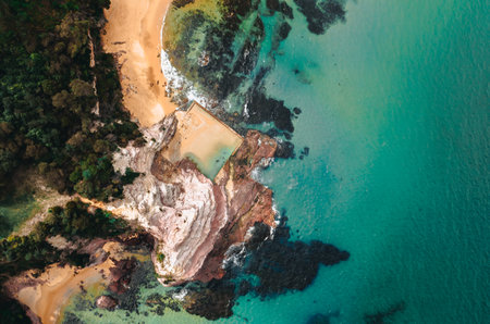 Aerial Drone Shot of Aslings Beach Rock Pool in Eden, New South Wales, Australia.の写真素材