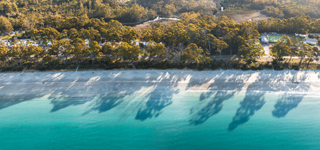 Drone Birdseye view of Adventure Bay, Tasmania, Australia. Blue water with shadows during sunset. Beautiful beach and travel concept.の写真素材