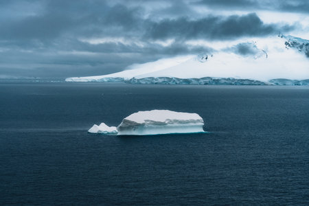 A floating iceberg in the antarctic peninsula, antarctica and arctic greenland. Global warming and...