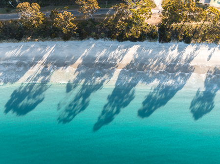 Drone Birdseye view of Adventure Bay, Tasmania, Australia. Blue water with shadows during sunset. Beautiful beach and travel concept.の写真素材