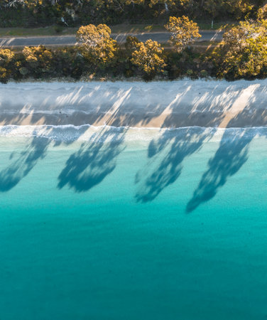 Drone Birdseye view of Adventure Bay, Tasmania, Australia. Blue water with shadows during sunset. Beautiful beach and travel concept.の写真素材