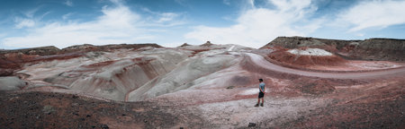 bentonite hills Amazing aerial view. Two tourists looking at camera. Located in Capitol Reef National Park, United States, Utah.の写真素材