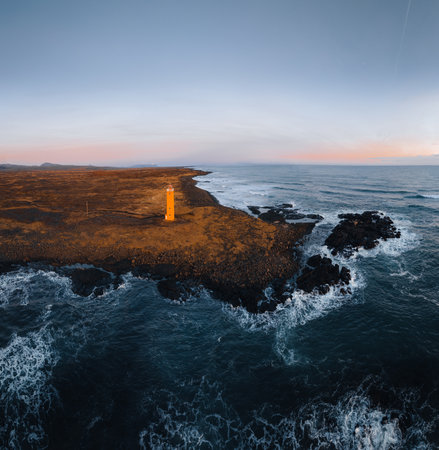 Aerial Drone photo of orange Lighthouse on the seashore in the Iceland. Western Icelandic coast and the lighthouse at Snaefellsnes Peninsula Icelandic landscape in the summer time. Iceland travel image.の写真素材