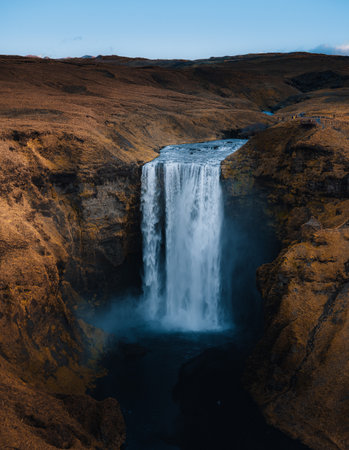 Iceland. Aerial view on the Skogafoss waterfall. Landscape in the Iceland from air. Famous place in Iceland. Landscape from drone. Travel concept. Sunset and sunrise. Soft light.の写真素材