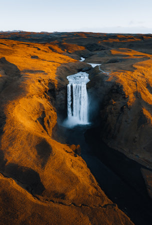 Iceland. Aerial view on the Skogafoss waterfall. Landscape in the Iceland from air. Famous place in Iceland. Landscape from drone. Travel concept. Sunset and sunrise. Soft light.の写真素材