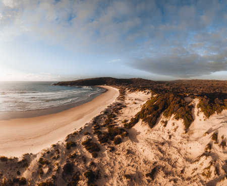 Aerial Drone view One Mile Beach during sunrise sunset with sand dunes. Forster, Great Lakes, Australiaの写真素材