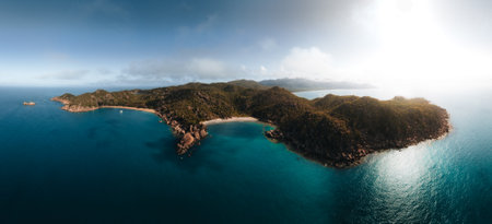 Radical Bay Beach at Arcadia at Magnetic Island near Townsville in Queensland, Australia - Aerial drone footage with rocks, waves, cliffs, ocean, trees, coast, views and scenery.の写真素材