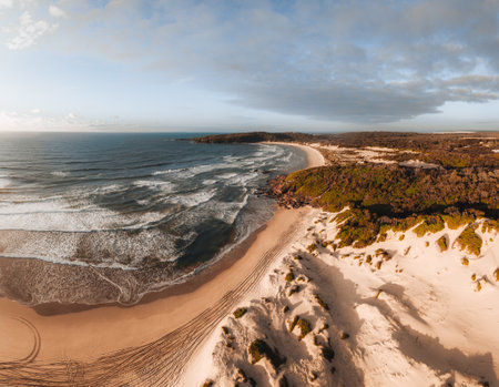 Aerial Drone view One Mile Beach during sunrise sunset with sand dunes. Forster, Great Lakes, Australiaの写真素材