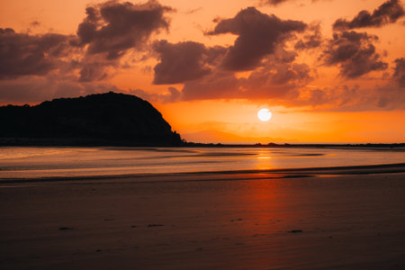 Colorful sunrise at the beach of Cape Hillsboroughの写真素材