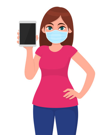 Young girl in medical face mask showing tablet computer. Woman holding digital gadget or pad. Female character. Corona virus epidemic outbreak. Modern technology. Cartoon illustration in vector designのイラスト素材