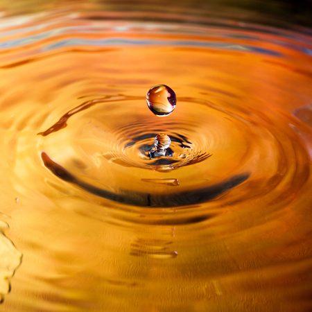 Colorful water drop splash in water macrophotographyの写真素材