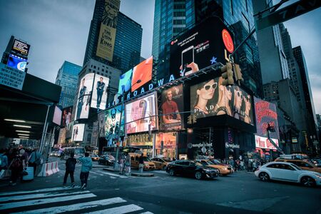 New York City, USA - May 20, 2014: Times Square during a calm evening. People are walking on the...